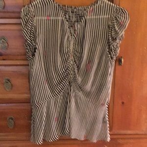 Black and creme striped top. Touches of pink